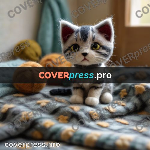 Wool painting: grey kitten indoors