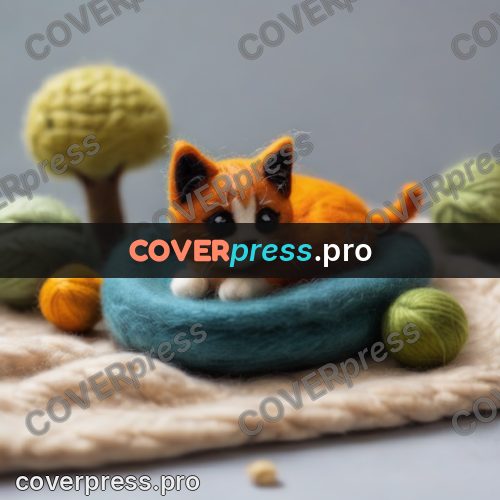 Wool painting: kitten lying among yarn balls