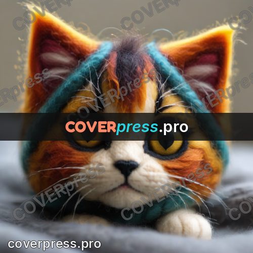 Wool painting: kitten nestled into yarn