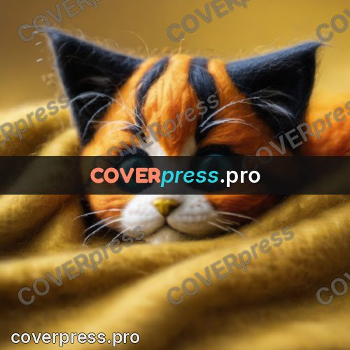 Wool painting: kitten nestled into yarn