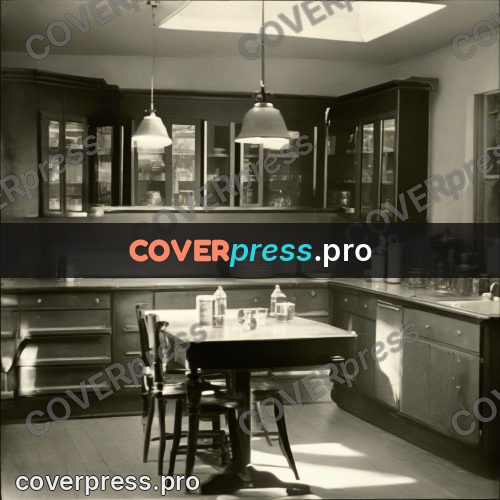 Black and white photo: kitchen with a table and lamps