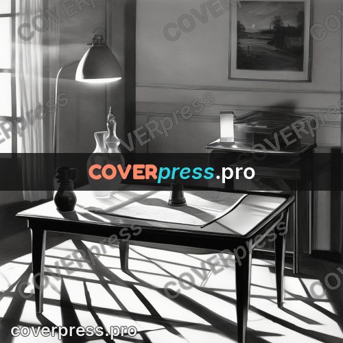 Black and white photo: table with a lamp and papers