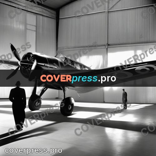 Black and white photo: aeroplane by the hangar doors
