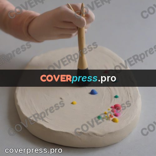 Stop motion character: hand with a brush on clay