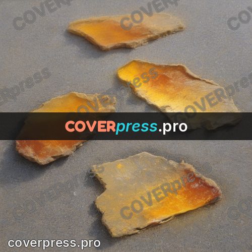 Soft pastel painting: pieces of amber on grey sand