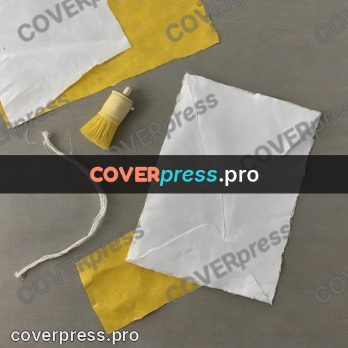 Wax crayon drawing: yellow and white paper pieces